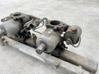 JAGUAR: A Jaguar Mark II inlet manifold with water rail and carburettors. [Location: Sydney] - 5