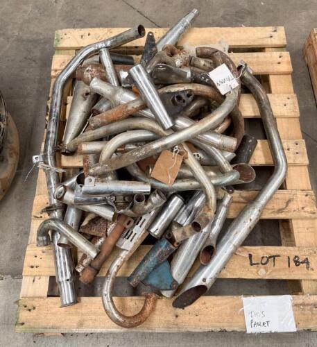 EXHAUST PARTS: A group of assorted exhaust pipes and tubing
