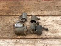 FLOAT BOWLS: A group of six pre-war carburettor float bowls