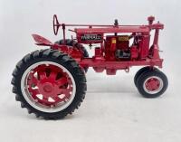 FARMALL: A 1:12 scale Farmall F-20 tractor by Franklin Mint, complete with original packaging.