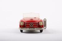 SHUCO: A late 1950s- early 1960s Shuco No.2097 Mercedes-Benz 190SL in red, wind up complete with key, made in Western Germany, 22cm long - 2