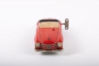 SHUCO: A late 1950s- early 1960s Shuco No.2097 Mercedes-Benz 190SL in red, wind up complete with key, made in Western Germany, 22cm long - 3