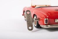 SHUCO: A late 1950s- early 1960s Shuco No.2097 Mercedes-Benz 190SL in red, wind up complete with key, made in Western Germany, 22cm long - 9