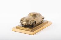 PORSCHE: A fine and rare heavy brass sculpture of Porsche 356 on a double plinth base, with etched artist signature '2001 Martin Russell', 12cm high, 28.5cm long, 16cm wide overall - 2