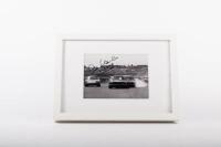 ALAN HAMILTON: A framed & glazed photograph signed by the late Alan Hamilton depicting a late 1960s Alan Hamilton in a Porsche 911