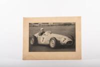 STIRLING MOSS: A black and white circa 1950s photograph of Stirling Moss