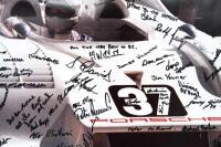 PORSCHE 917/30: A large circa mid 1980s framed photograph of Alan Hamilton sitting in a Can-Am Porsche 917/30, signed by Hamilton staff - 3