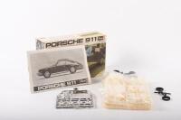 PORSCHE 911: An early 1970s Revell 1:25 scale, Porsche 911 model kit, most parts sealed appears to be complete