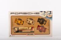 MATCHBOX: A circa 1990s Matchbox Porsche racing set (MC-23), 1:64 scale, includes a Porsche truck and four Porsche cars in original packaging