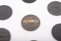 PORSCHE MEDALLIONS: A group of seven&nbsp;commemorative Porsche medallions from the 1990s - 2