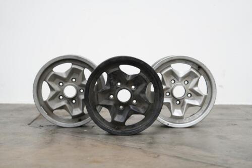 PORSCHE 944: Three circa 1974 Porsche 944 (or 911) 15IN x 6IN 'cookie cutter' alloy wheels, [P/N 91138102300], all wheels have some marks