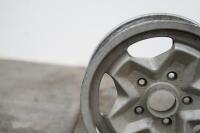 PORSCHE 944: Three circa 1974 Porsche 944 (or 911) 15IN x 6IN 'cookie cutter' alloy wheels, [P/N 91138102300], all wheels have some marks - 10
