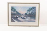 ALAN FEARNLEY: A limited edition (304/850) framed & glazed print 'Sunset at Le Mans' depicting the Rothmans Porsches at Le Mans 1983, signed by the artist Alan Fearnley and drivers Jacky Ickx & Derek Bell