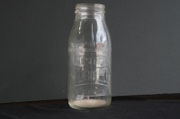 GOLDEN FLEECE: An original embossed Golden Fleece 'Hex Logo' one imperial quart glass oil bottle