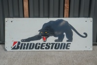 BRIDGESTONE: A c1980s Bridgestone tyres screenprinted advertising sign featuring the black panther, 33cm high, 86cm wide