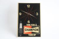 CHAMPION: A c1960s-1970s Champion Spark Plugs 'Time for a Tune-Up' plastic wall clock, some marks to face, 46cm high, 30.5cm wide - 2