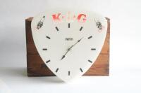 KLG: A c1960s K.L.G spark plugs wall clock by Smiths, fading seen to red lettering, right hand side spark plug missing top, 44cm high, 43.5cm wide - 2