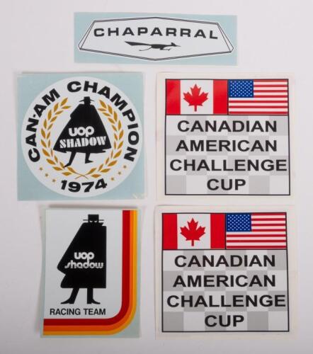 101 · RE-PRINT STICKERS: A collection of four re-print stickers including 'Chaparral', 'Can-Am Champion 1974' and others