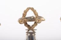 TROPHIES: Three trophies, all not inscribed, all have wreath and racing car finials with round bakelite bases - 3