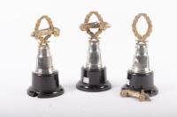 TROPHIES: Three trophies, all not inscribed, all have wreath and racing car finials with round bakelite bases - 5