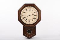 WALL CLOCK: A wall clock in timber case thought to be a replica Seth Thomas