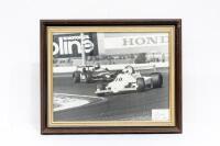 ALFREDO COSTANZO: Two large framed & glazed photographs of Alfred Costanzo driving a Tiga, one colour & one black & white, with largest photo including a personal message and signature from Alfredo to Alan Hamilton dated 1982 - 2