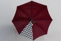 PORSCHE UMBRELLA: A circa 1980s Porsche umbrella with Porsche emblem fixed to wooden handle, maroon in colour with chequered flag detail - 3