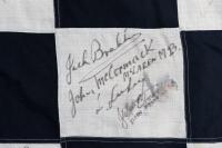 CHEQUERED FLAG: An important race used signed chequered flag from the 1976 Australian Grand Prix & ATC Hang Ten 400 race held at Sandown, signatures include Peter & Phil Brock, Colin Bond, Peter Janson, Jack Brabham, Kevin Bartlett, John Goss (winner), Jo - 7
