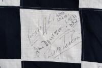 CHEQUERED FLAG: An important race used signed chequered flag from the 1976 Australian Grand Prix & ATC Hang Ten 400 race held at Sandown, signatures include Peter & Phil Brock, Colin Bond, Peter Janson, Jack Brabham, Kevin Bartlett, John Goss (winner), Jo - 8