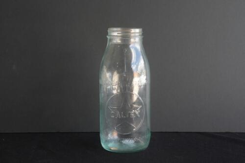 CALTEX: An original embossed Caltex one quart glass oil bottle