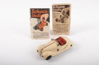 SHUCO: A late 1930s Shuco Examico 4001 BMW 328 wind up toy in cream with red interior