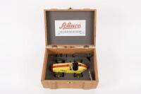 SHUCO: A reproduction Shuco tin toy wind up #1070 Grand Prix Racer model in yellow & red No.24, model within wooden presentation box with tools, key and stand