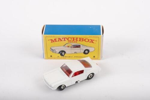 MATCHBOX: A late 1960s Matchbox series No.8 Ford Mustang in white with red interior, featuring adjustable steering, within original box