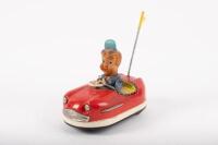 BUMPER CAR: A c1960s Japanese tin toy bumper car 'No.15', wind up, with seated figure, 14cm long. By KO Toys Japan