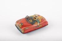SAFARI HUNTER: A c1950s-1960s tin toy African Safari hunter car by Nomura Japan, friction driven, 9cm in length