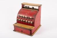 BOOMAROO: A c1950s Australian Boomaroo Toys cash register in red and yellow, 19cm high