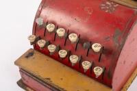 BOOMAROO: A c1950s Australian Boomaroo Toys cash register in red and yellow, 19cm high - 2