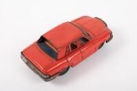 MERCEDES: A small Japanese tin toy Mercedes-Benz sedan in red, marked 'TT' Japan to base, 15cm in length. - 2