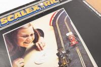 ACCESSORIES: A group of various Scalextric track accessories including track obstacles, event time board, start/finish banner, controllers, and others. - 2