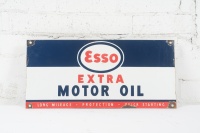 ESSO: An original enamel Esso 'Extra Motor Oil' ten bottle rack sign, 27cm high, 58cm wide