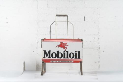 MOBIL: An original Mobiloil eight bottle rack with enamel sign to front
