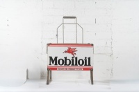 MOBIL: An original Mobiloil eight bottle rack with enamel sign to front&nbsp;