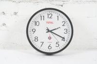 TOTAL: A quartz wall clock with Total advertising, likely c1980s-1990s, 24.5cm high, 24.5cm wide