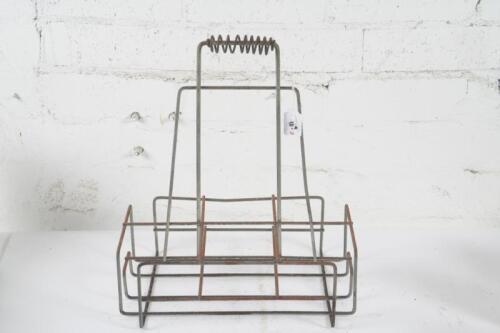 BOTTLE RACK: An original six bottle wire rack as suited for oil bottles