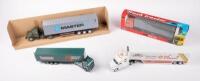 TRUCKS: A group of four model trucks including a Bunnings&nbsp;and Shell DJR V8 Supercars racing transporter