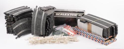 SCALEXTRIC: A large group lot of Scalextric track sections and some accessories such as track guard railing