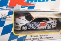 V8 SUPERCARS: Three V8 Supercars models including Classic Carlectables 1:43 scale Steven Richards #7 Kmart Racing Commodore and two 1:32 scale Scalextric V8 Supercars, Lowndes Vodafone #888 and Skaife HRT #2 - 2