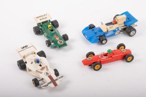 477 · SCALEXTRIC: Three c1970s-1980s Scalextric models including C67 Lotus, C051 BRM P160, C012 Shadow and a Polistil Matra Simca F1 slot car