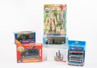 MODELS: A group of boxed toys/models includes Britains Land Rover discovery, Corgi London Cab, Disney Bus set and others