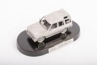 LAND ROVER: A pewter Land Rover Discovery model on oval timber base, with Land Rover Discovery nameplate, model 10cm long, Land Rover P/N STC8750, in original fitted box